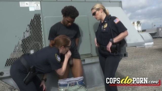 Black thug is fucking with a hot MILF on the rooftop after being apprehended.